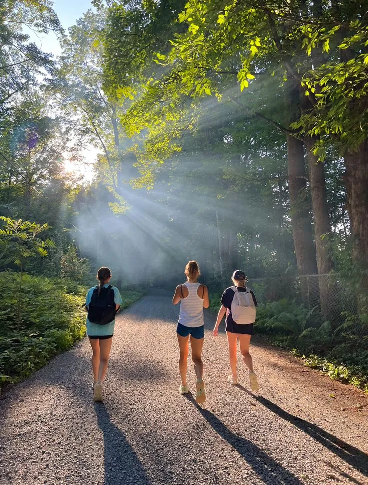 Friends on a nature trail during early morning hours